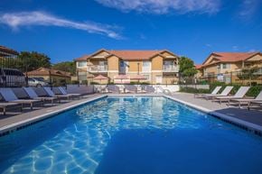Pittsburg apartment for rent - A swimming pool in front of apartment buildings.