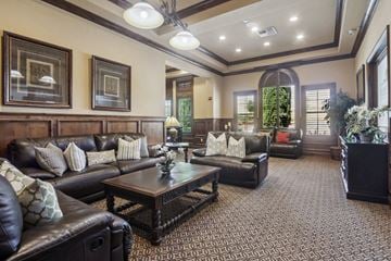 Pittsburg apartment for rent - A living room with a brown leather couch and a coffee table.