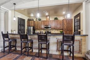 Pittsburg apartment for rent - A kitchen with a bar area and four chairs.