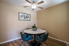 Pittsburg apartment for rent - A dining room with a round table and four chairs.