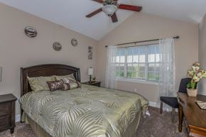Valrico apartment for rent - Bloomingdale Woods Apartments Valrico Florida Bedroom with Vaulted Ceiling and Ceiling Fan and Windows with Furniture