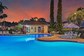 Tampa apartment for rent - Park Avenue Apartments Tampa Florida Pool and Clubhouse with Sunset in Background