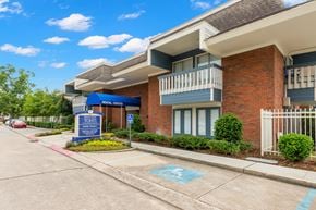 River Ridge apartment for rent - A building with a sign that says "TONTI" in front of it.
