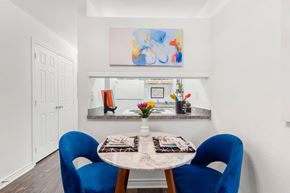 Metairie apartment for rent - A dining room with a table and chairs.