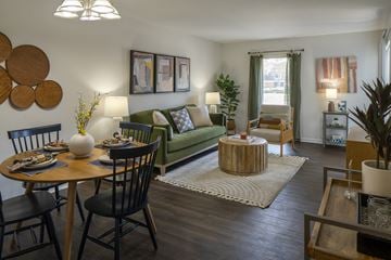 River Ridge apartment for rent - A living room with a dining table and chairs.
