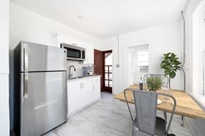 El Paso apartment for rent - a kitchen with stainless steel appliances and a wooden table