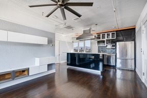 El Paso apartment for rent - A modern kitchen with a black countertop and stainless steel appliances.