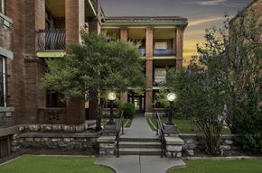 El Paso apartment for rent - A building with a balcony and a staircase leading to it.