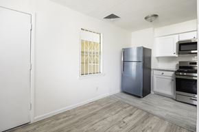 El Paso apartment for rent - an empty kitchen with stainless steel appliances and a window