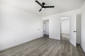 El Paso apartment for rent - an empty living room with white walls and a ceiling fan