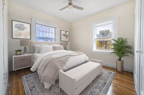 El Paso apartment for rent - A bedroom with a large bed and a ceiling fan.