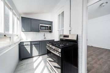 El Paso apartment for rent - A modern kitchen with a black stove top oven.