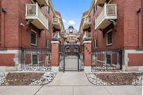 Denver apartment for rent - the entrance to a building with a wrought iron gate