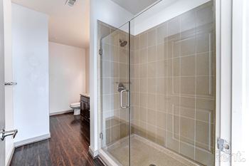 Walk-in showers with frameless glass doors*