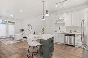 Cary apartment for rent - A modern kitchen with a dining table and chairs.