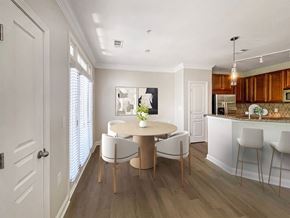Cary townhouse for rent - A dining room with a round table and chairs.