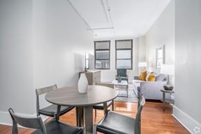 Nashville apartment for rent - A modern dining room with a round table and chairs.