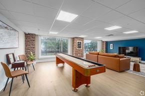 Nashville apartment for rent - A room with a pool table and chairs.
