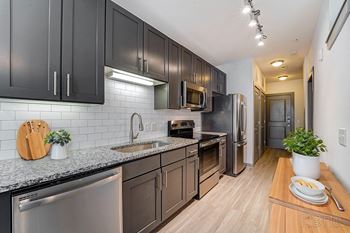 Glass subway tile backsplash