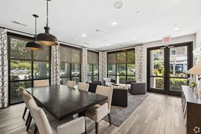Charleston apartment for rent - A dining room with a large table and chairs.