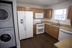 Indianapolis apartment for rent - a kitchen with a washing machine and a refrigerator