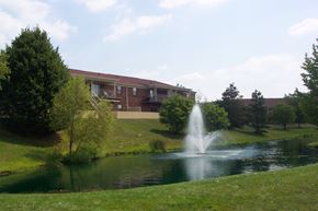 Centerville apartment for rent - a fountain in the pond in front of a building