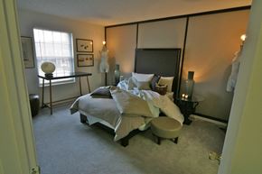 Indianapolis apartment for rent - a bedroom with a bed and a dresser and a window