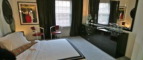 Indianapolis apartment for rent - a bedroom with a bed and a dresser with a mirror