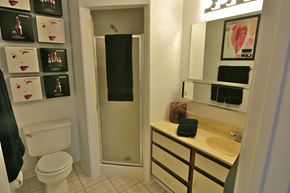 Indianapolis apartment for rent - a bathroom with a shower toilet and sink and a mirror