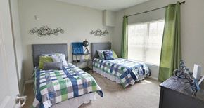 Scottdale apartment for rent - decatur affordable family apartment a bedroom with two twin beds and green curtains