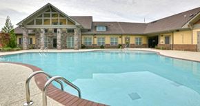 Scottdale apartment for rent - decatur affordable family apartment a swimming pool with a building in the background