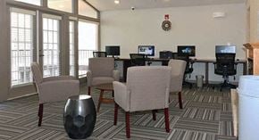 Stone Mountain apartment for rent - a conference room with chairs and computers in it