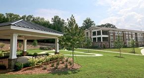 Stone Mountain apartment for rent - a large yard with a pavilion and some houses