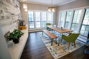 Decatur apartment for rent - a dining room with a wooden table and green chairs