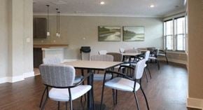 Scottdale apartment for rent - a dining room with tables and chairs