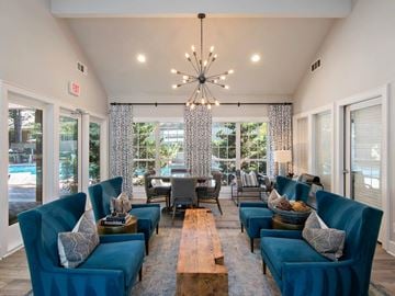 Decatur apartment for rent - A living room with blue couches and a wooden coffee table.