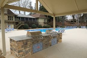 Stone Mountain apartment for rent - a covered patio with a barbecue grill next to a pool