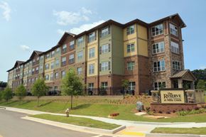 Scottdale apartment for rent - affordable senior luxury decatur an apartment building on the corner of a street