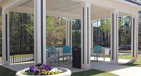Stone Mountain apartment for rent - a covered patio with chairs and a table with flowers