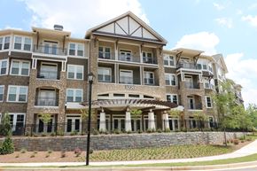 Scottdale apartment for rent - decatur affordable family apartment an image of a large apartment building with a stone wall