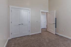 Mt Union apartment for rent - an empty bedroom with two doors and a carpeted floor