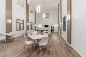 Mt Union apartment for rent - a dining room with white tables and chairs and a wood floor
