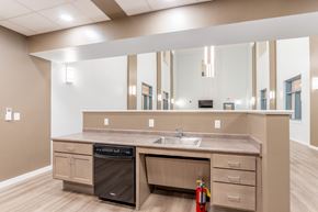 Mt Union apartment for rent - a kitchen with a sink and a dishwasher and a large mirror