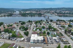 Monaca apartment for rent - A small town with a river running through it and a bridge crossing the river.