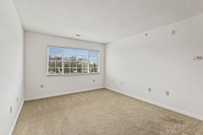 Dayton apartment for rent - Empty room with carpeted floor and a window.