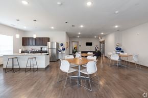Arlington apartment for rent - A modern kitchen with a dining table and chairs.