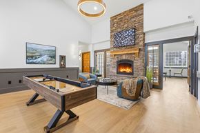 West Richland apartment for rent - A room with a pool table and a fireplace.