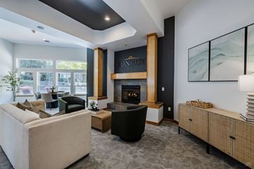 Everett apartment for rent - A living room with a fireplace and a painting on the wall.