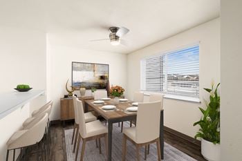 A dining room with a wooden table and chairs and a window