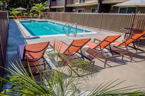 Woodland apartment for rent - a pool with a poolside deck with chairs and a swimming pool at Ella 1711 Apartments, Woodland, CA
